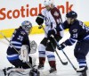 BORIS MINKEVICH / WINNIPEG FREE PRESS  
Jets goalie Al Montoya, Avalanche #90 Ryan O'Reilly, and Jets #39 Tobias Enstrom fight for the puck as the Jets take on the Avalanche tonight at MTS Centre.