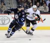 Phil Hossack / Winnipeg Free Press
Winnipeg Jet captain Andrew Ladd deeks around Pittsburgh Penquin (19) Beau Bennett Thursday at the MTS Center in first period action.