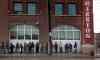 Phil Hossack / Winnipeg Free Press files
Some of Winnipeg's homeless line up outside Siloam Mission in this 2014 file photo.