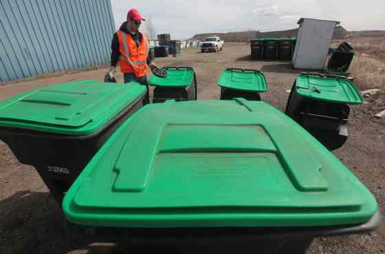 Bruce Bumstead/Brandon SunSummer employee Chris Sitko assembles new composting bins at the Eastview Landfill in Brandon.