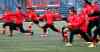 KEN GIGLIOTTI / WINNIPEG FREE PRESS
Desiree Scott (centre, with arms extended), with teammates during warm-up as Team Canada practises in preparation for the game against Team USA.