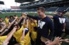Ruth Bonneville / Winnipeg Free Press files
Former Blue Bomber Doug Brown leads a cheer while directing kids to different drill stations at Investors Group Field during last year's KidSport Football Camp.