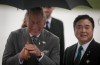 Melissa Tait / Winnipeg Free Press
Prince Charles laughs with Lt. Gov. Philip Lee after a wet and windy arrival on the tarmac at CFB Winnipeg Tuesday evening. The royal couple will visit Winnipeg for 27 hours.