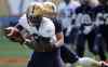 TREVOR HAGAN / WINNIPEG FREE PRESS
Derek Jones, right, hauls down Mario Urrutia during Big Blue practice at Investors Group Field. Both will be new faces this season, if they make the team.