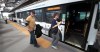 Phil Hossack / Winnipeg Free Press
Bombers fans Tom and Randi Donahue board an express bus to Investors Group Field Monday night at Osborne station.