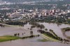 Tim Smith / Brandon Sun
Downtown Brandon is seen in the background behind the flood waters covering 1st Street, Dinsdale Park and the Optimist Park soccer pitches on Saturday morning.