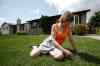 JOHN WOODS / WINNIPEG FREE PRESS
Maples resident Debbie Lynch weeds her lawn while wearing a mosquito deterrent on her hip.