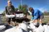 JOE BRYKSA / WINNIPEG FREE PRESS
Terry Hutchinson, left, and Betty Grangersling help with sandbagging efforts at East Delta Beach Monday.