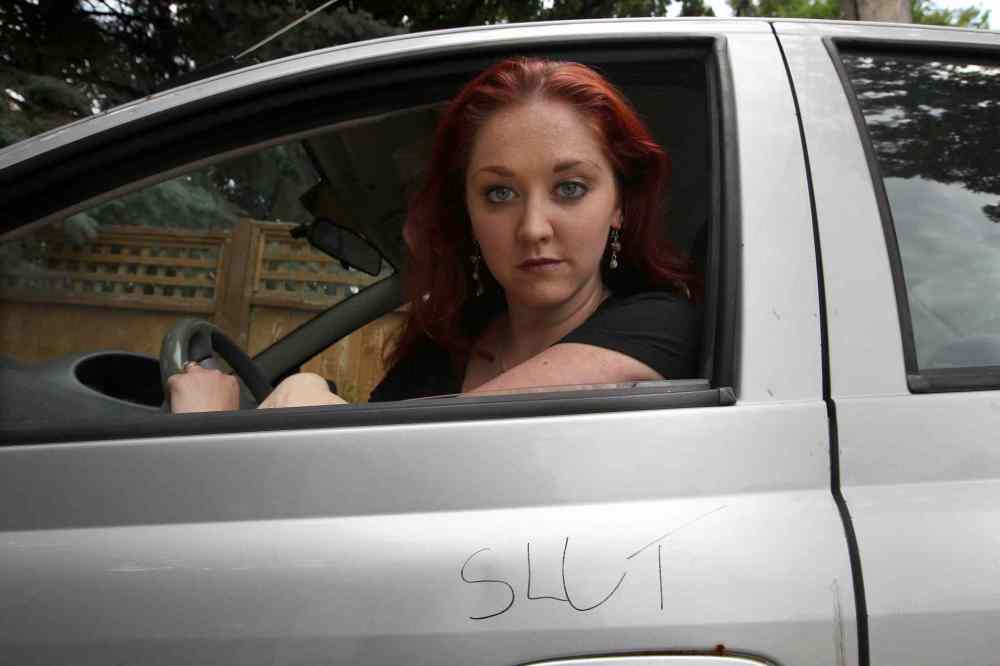 JOE BRYKSA / WINNIPEG FREE PRESS
Theresa Thomson inside her car that was defaced recently, part of the intimidation the actress has faced over the play Lies of a Promiscuous Woman that some have blasted as blasphemous.