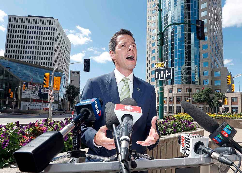 Mayor Candidate BOWMAN PRESSER .- 1:30 p.m. presser, Portage and Main (outside Richardson building), Brian Bowman, ǃ˙will announce the first in a series of announcements aimed at making downtown an open, accessible, safe and vibrant place for all Winnipeggersǃ˘ also comments to say ǃ˙words hurtǃ˘ regarding the Ste eves controversy . (Rollason)Aug 11 2014 / KEN GIGLIOTTI / WINNIPEG FREE PRESS