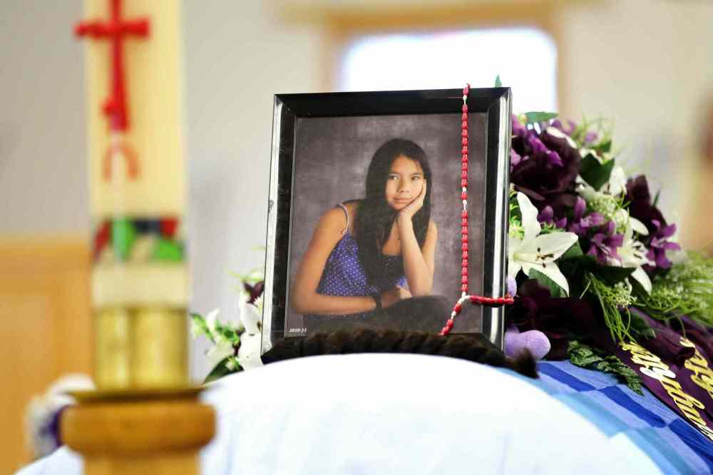 Ruth Bonneville / Winnipeg Free Press files
Tina Fontaine's photographs sit on top of her casket at her funeral in 2014.