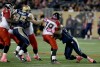 TREVOR HAGAN/WINNIPEG FREE PRESS
Winnipeg Blue Bombers' Jake Thomas (95) and Kashawn Fraser (93) sack Calgary Stampeders' Bo Levi Mitchell (19).