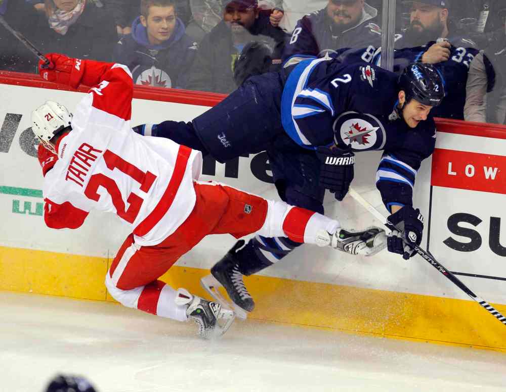 BORIS MINKEVICH / WINNIPEG FREE PRESS
The Jets' Adam Pardy gets by Redwings' Tomas Tatar during the first period of Thursday's game at the MTS Centre.