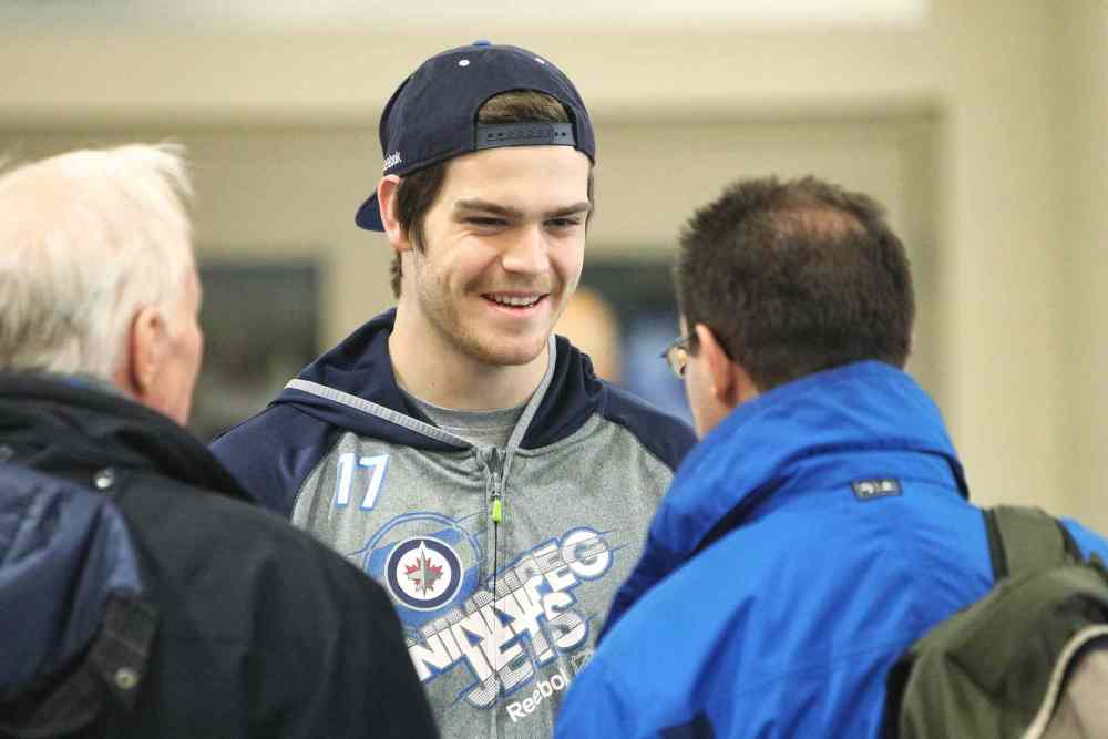 Mike Deal / Winnipeg Free Press
Winnipeg Jets' Adam Lowry talks to fans before practice this morning. At the press conference after practice, head coach Maurice made cracks about the power-play unit’s ineptitude. Winnipeg has now gone five games without a power-play goal, a stretch of 18 chances.