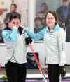 MIKE DEAL / WINNIPEG FREE PRESS
Skip Beth Peterson wipes her eyes with a smiling Robyn Njegovan (third) after winning the Junior Women's Provincial Championship at the Assiniboine Memorial Curling Club Wednesday evening.
