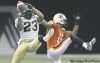 Darryl Dyck / the canadian press
Winnipeg's Jonathan Hefney high-steps to intercept a pass intended for Lions' Paris Jackson during the first half Friday night in Vancouver.