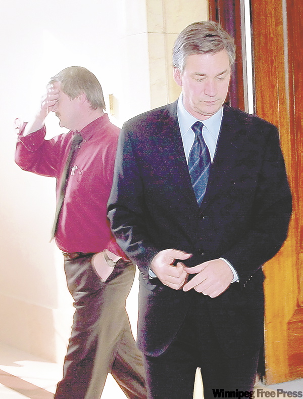 JOE BRYKSA / WINNIPEG FREE PRESS ARCHIVES
Brian Short, a union representative from the International Association of Machinists and Aerospace Workers, leaves a meeting with Doer in March 2002. The premier recommended the union hold a vote to try to save the Motor Coach Industries bus plant.
