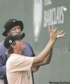 RICH SCHULTZ / THE ASSOCIATED PRESS
Webb Simpson catches his ball from a spectator after hitting his tee shot into the hospitality suite as a rules official looks on along the 18th fairway Friday.