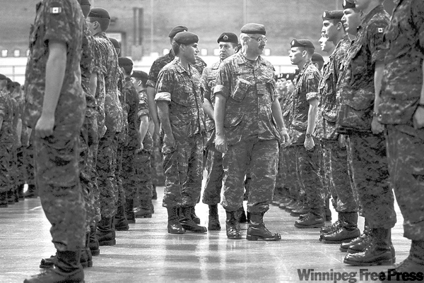 RUTH.BONNEVILLE@FREEPRESS.MB.CA
ol. Robert Poirier (middle, wearing glasses), Commander of 38 Canadian Brigade Group addresses over 80 Canadian Forces Reserve recruits who graduated Sunday at Minto Armoury.