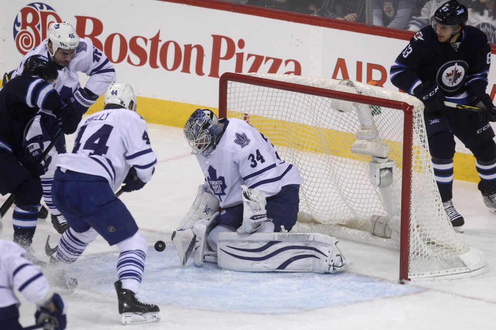 Ruth Bonneville / Winnipeg Free Press
Toronto Maple Leafs goaltender James Reimer (34) manages to deflect the puck from going in the net during the first period Saturday.
Jan 03, 2015 Ruth Bonneville / Winnipeg Free Press
Winnipeg Jets vs Toronto Maple Leafs