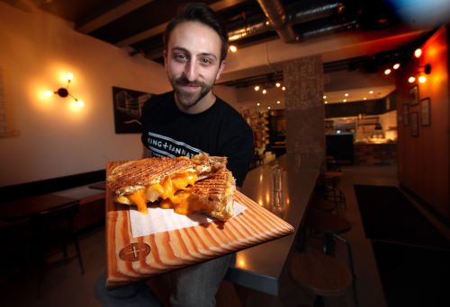 Phil Hossack / Winnipeg Free Press
King + Bannaytne's Mike Del Buono shows off the 'Apple Pie' grilled cheese.