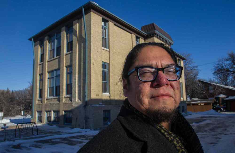 MIKE DEAL / WINNIPEG FREE PRESS
Maeengan Linklater, in front of the former site of the Assiniboine Residential School, formally recognized as one of Canada’s Historic Places, not for being a residential school but for its role as the Julia Clark School, which featured prominantly in the early development of the city’s child welfare system. It is now houses the Canadian Centre for Child Protection.