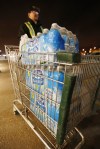 John Woods / Winnipeg Free Press
Kevin Tetu stocks up on bottled water Tuesday.