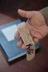 David Lipnowski / Winnipeg Free Press
Murray Sinclair, the judge of the Pediatric Cardiac Inquest, with the inquest report and a bookmark that he made naming each of the 12 children whose deaths led to the inquest.