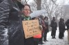 Ashlyn Haglund holds a sign as people  gather at The Forks Thursday in protest of the way the criminal justice system handled Cindy Gladue's death.