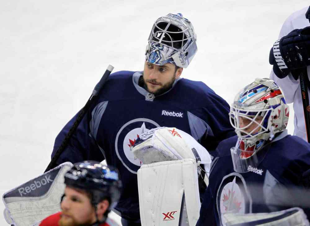 BORIS MINKEVICH/WINNIPEG FREE PRESS
Ondrej Pavelec, left, at a Winnipeg Jets practice.