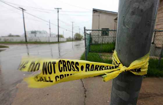 Remnants of Police Tape left on the 800 block of Alexander Avenue where the police had been investigating a homicide, Sunday, May 17, 2015. (TREVOR HAGAN/WINNIPEG FREE PRESS)