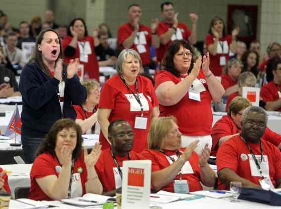 Colin Corneau / Brandon Sun filesManitoba Government Employees Union members loudly applaud mention of their contract negotiations at the 2015 Manitoba Federation of Labour conference last year in Brandon.