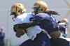 Mike Deal / Winnipeg Free Press
Jhomo Gordon (white jersey) is pulled down by Troy Stoudermire (1) during the first day of the Winnipeg Blue Bombers training camp.
