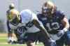Mike Deal / Winnipeg Free Press
Mike Willie (76) is chased down by Don Unamba (13) during the first day of the Winnipeg Blue Bombers training camp Sunday.