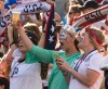 MELISSA TAIT / WINNIPEG FREE PRESS
Lady Liberty toasts the U.S. Women's National Team as they enter the stadium for their match against Sweden at the FIFA Women's World Cup in Winnipeg.