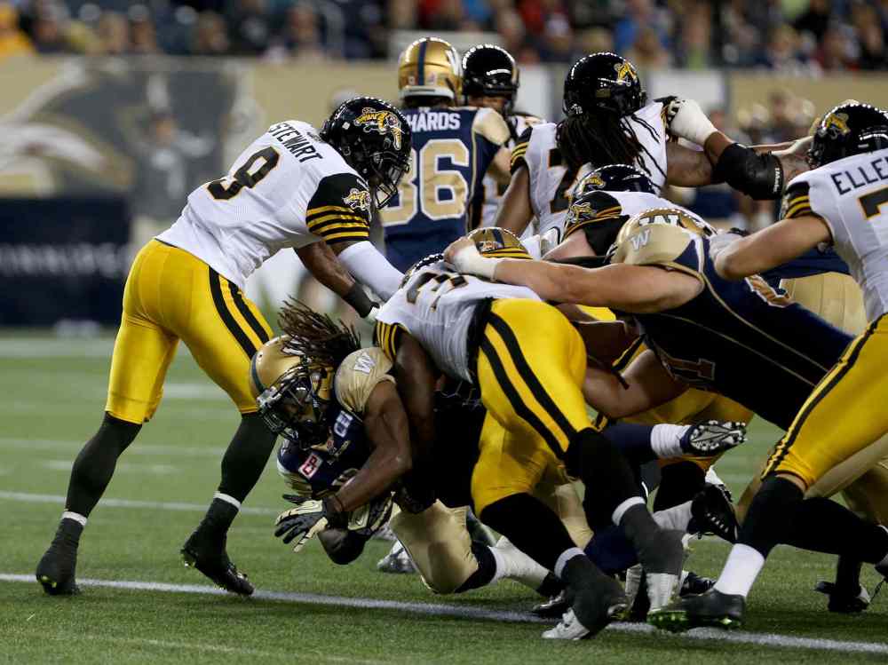 TREVOR HAGAN/WINNIPEG FREE PRESS
Winnipeg Blue Bombers' Paris Cotton (34) scores against the Hamilton Tiger-Cats' during preseason CFL action, Friday,..