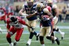 TREVOR HAGAN / WINNIPEG FREE PRESS
Calgary Stampeders' Juwan Simpson (12) can't tackle Winnipeg Blue Bombers' Tyler Thomas (24).