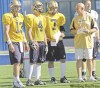 JOE.BRYKSA@FREEPRESS.MB.CA
New Bombers quarterbacks (from left) Casey Bramlet, Adam DiMichele and Ricky Santos get the once-over from head coach Mike Kelly at Canad Inns Stadium Thursday as running back Daryl Stephenson checks out the action on the field.