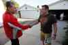 Liberal candidate Dan Vandal (L) talks with resident Remi Jobin as he door knocks in his St. Boniface-St. Vital riding Tuesday (John Woods / Winnipeg Free Press)