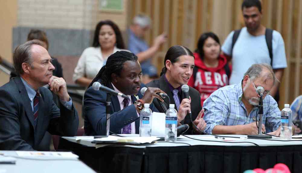 Federal election candidates (from left) Pat Martin (New Democratic Party), Don Woodstock (Green Party), Robert-Falcon Ouellette (Liberal Party) and Darrell Rankin (Communist Party) discuss their platforms on key downtown issues at a forum hosted by the Downtown Winnipeg BIZ at Portage Place Shopping Centre. (Jason Halstead/Winnipeg Free Press)