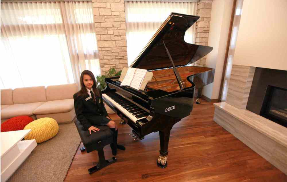 PHIL HOSSACK / WINNIPEG FREE PRESS
Sarah Shing says her new piano is very special and she is inspired to practice more.