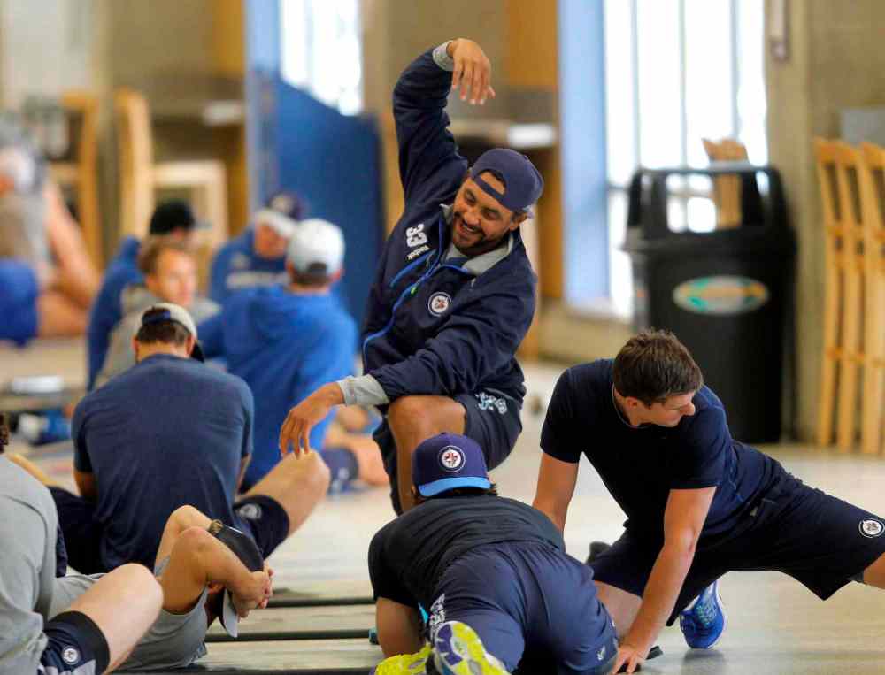 BORIS MINKEVICH / WINNIPEG FREE PRESS
Winnipeg Jets practise off the ice, stretching, on Wednesday.