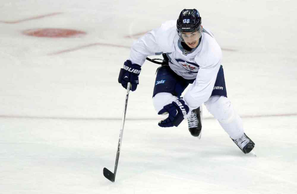 BORIS MINKEVICH / WINNIPEG FREE Press
Nic Petan, centre, has had a strong showing on the ice.