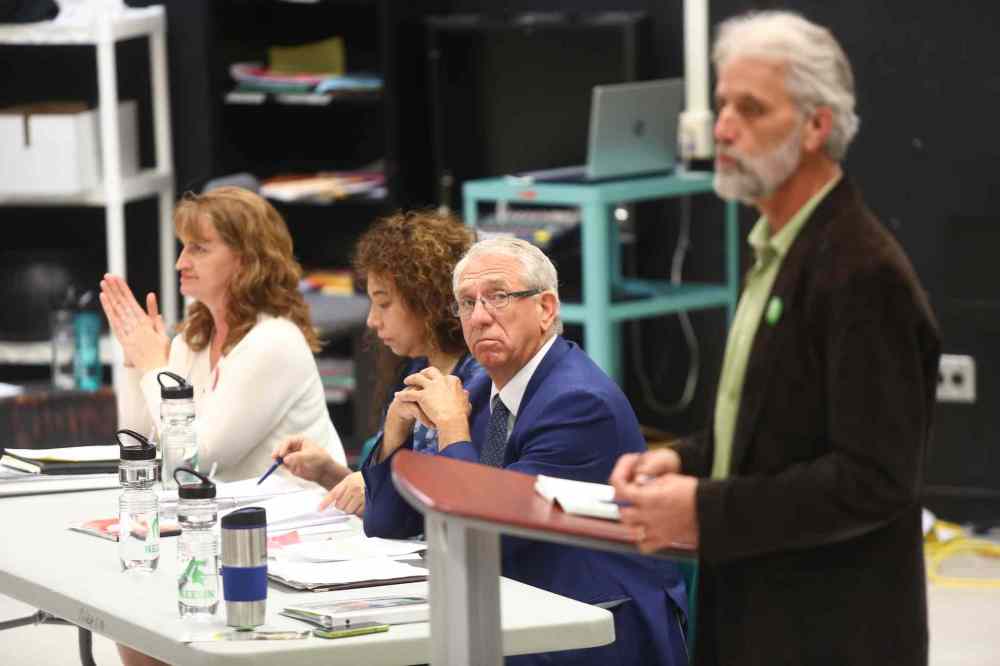 Bruce Bumstead/Brandon Sun
Brandon-Souris incumbent Larry Maguire looks as Green Party candidate David Neufeld speaks to students at Neelin High School in Brandon during a debate Tuesday. Maguire has been an exception to his party, attending all debates in his riding.