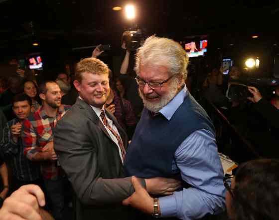 Jason Halstead / Winnipeg Free PressNDP candidate for Elmwood-Transcona, Daniel Blaikie, celebrates victory with his father, former MP Bill Blaikie, at the New Cavalier Inn on Regent Avenue West. on Mon., Oct. 19, 2015.