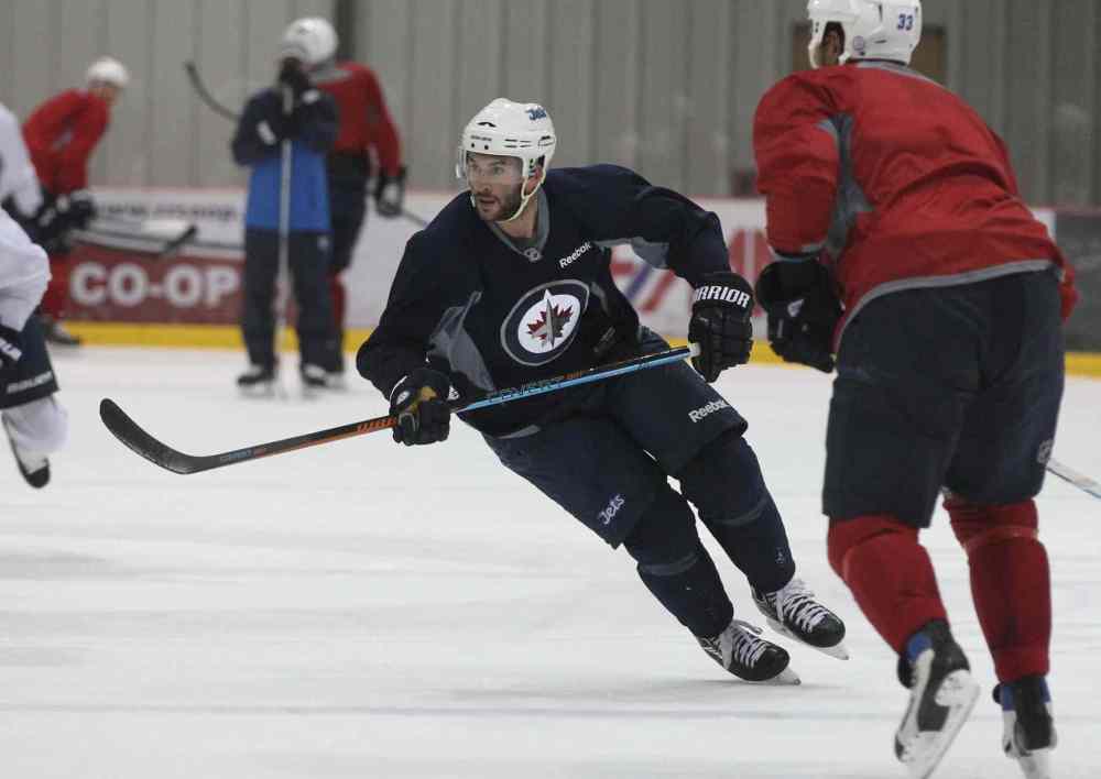 Ruth Bonneville / Winnipeg Free Press
Winnipeg Jets rugged right-winger Anthony Peluso ensures opposition players don't get too big for their britches.