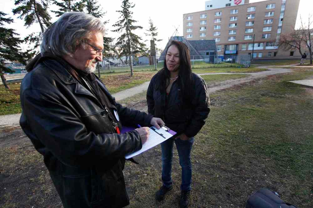 John Woods / Winnipeg Free Press
Al Wiebe completes the 2015 Street Homeless Census with June Moore outside Thunderbird House Monday. A census was taken of Winnipeg's homeless population.