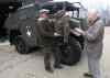 JOE BRYKSA / WINNIPEG FREE PRESS
Veteran Stan Butterworth, 91, right, visits Rob Fast to see his restored 1943 Field Artillery tractor in his yard in Steinbach.