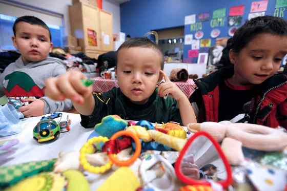 John Woods / Winnipeg Free PressCorbin Raven (C) along with his brother Caytin (L) and Zeus Olson search for some gifts at a Christmas popup shop at the Indigenous Family Centre Tuesday. Think Shift, an advertising agency based in Winnipeg, in partnership with North End Community Renewal Corp. and the Indigenous Family Centre has set up a pop-up shop in the city's North End where youth and community members are invited to shop for free gifts for family and friends.