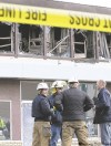 DAVID LIPNOWSKI / WINNIPEG FREE PRESS
Officials at the scene of Sun­day’s fatal bathhouse fire on Notre Dame Avenue.